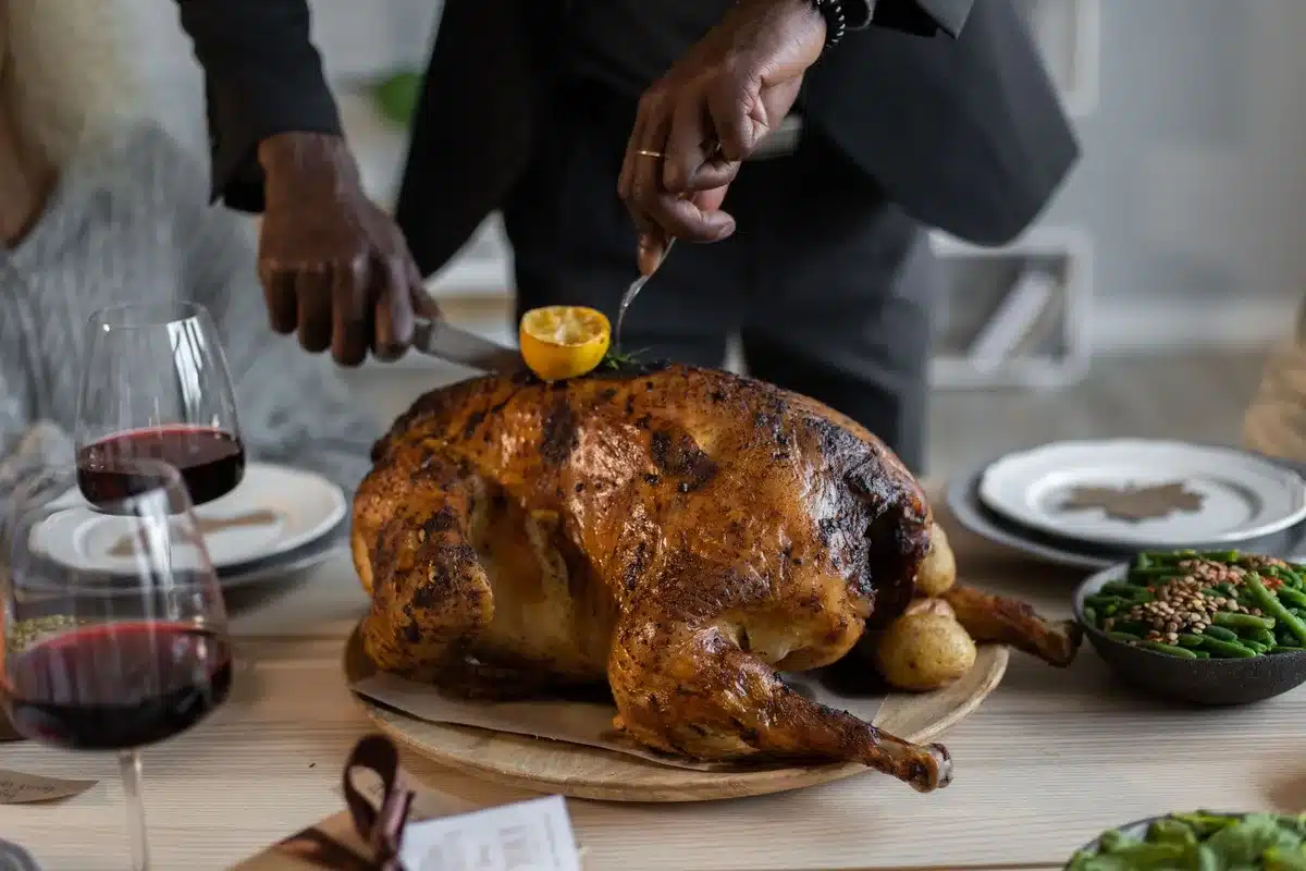 A festive Thanksgiving dinner table with traditional dishes and place settings.