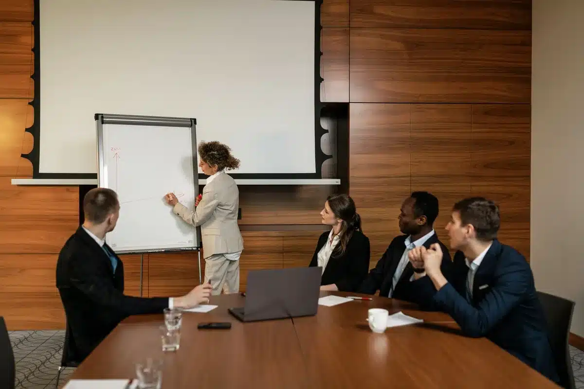 Boardroom with separated desks and dividing line symbolizing corporate structural separation in merger negotiations