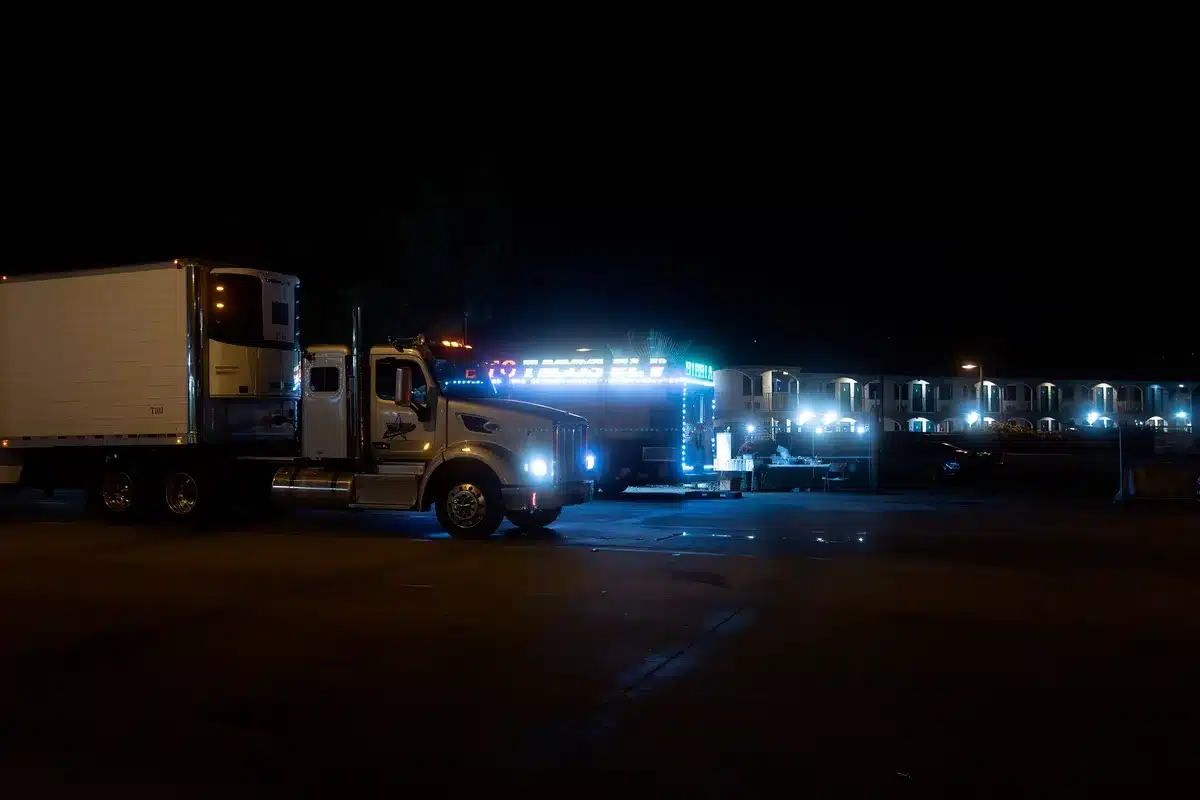 Moving trucks and packed boxes outside a California home during relocation