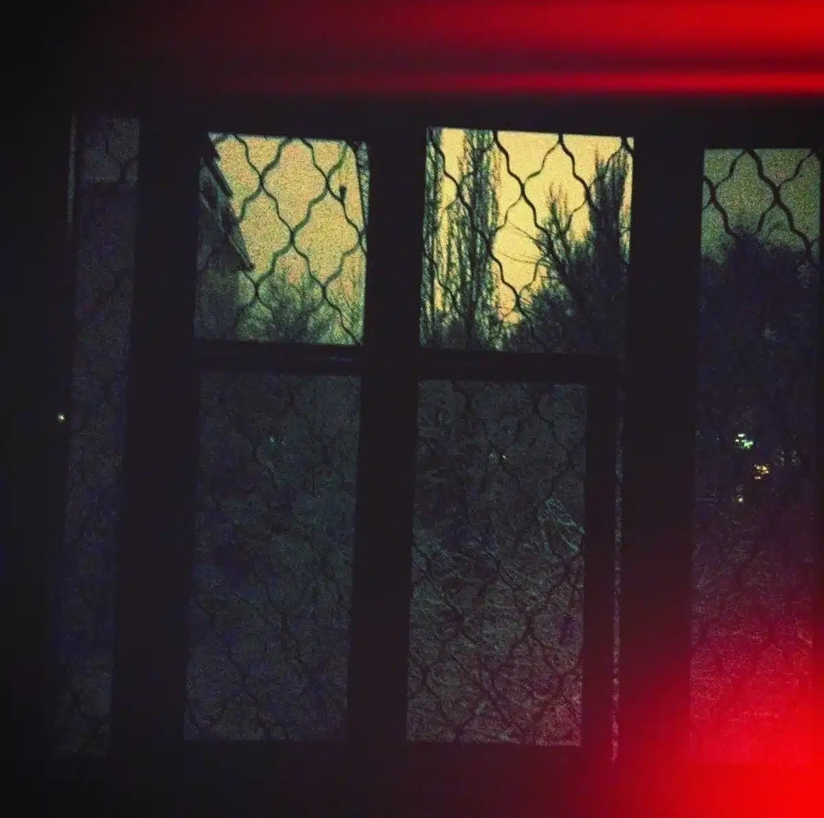 Shadowy farm setting with ominous atmosphere suggesting danger and ritual horror