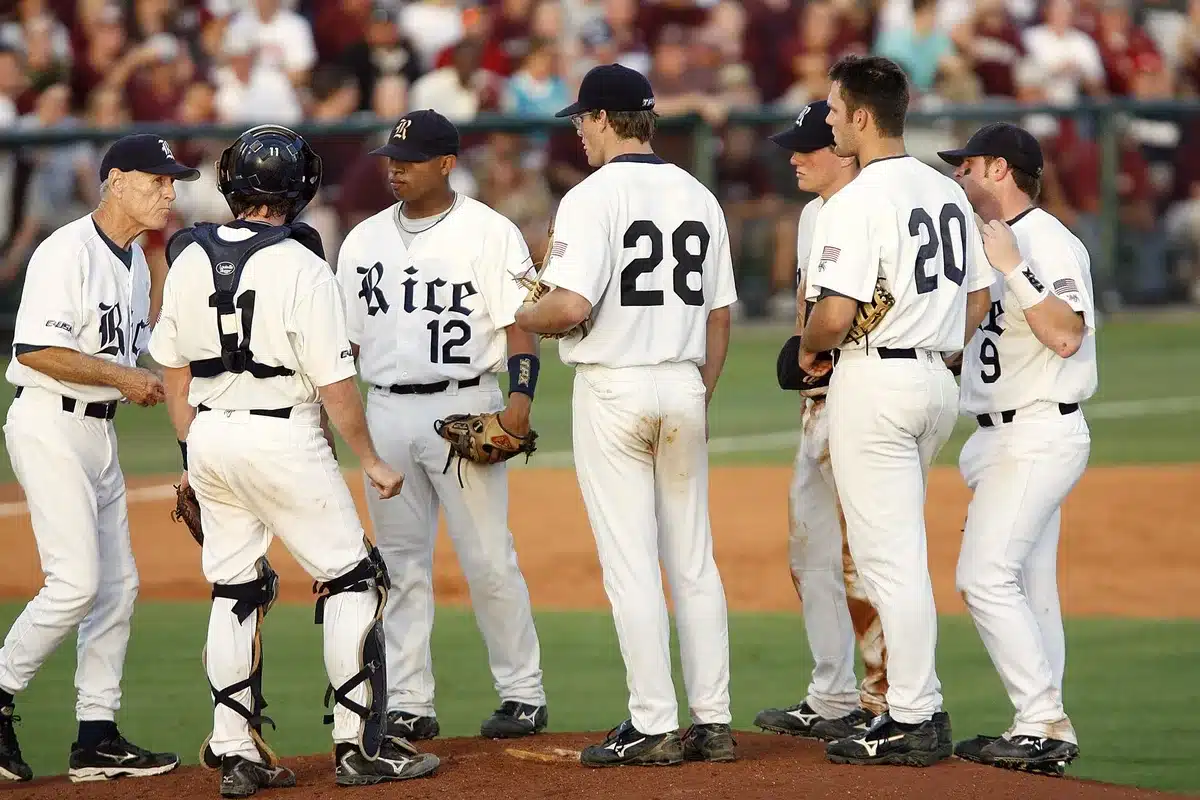 Catcher signaling to pitcher from behind home plate during a game