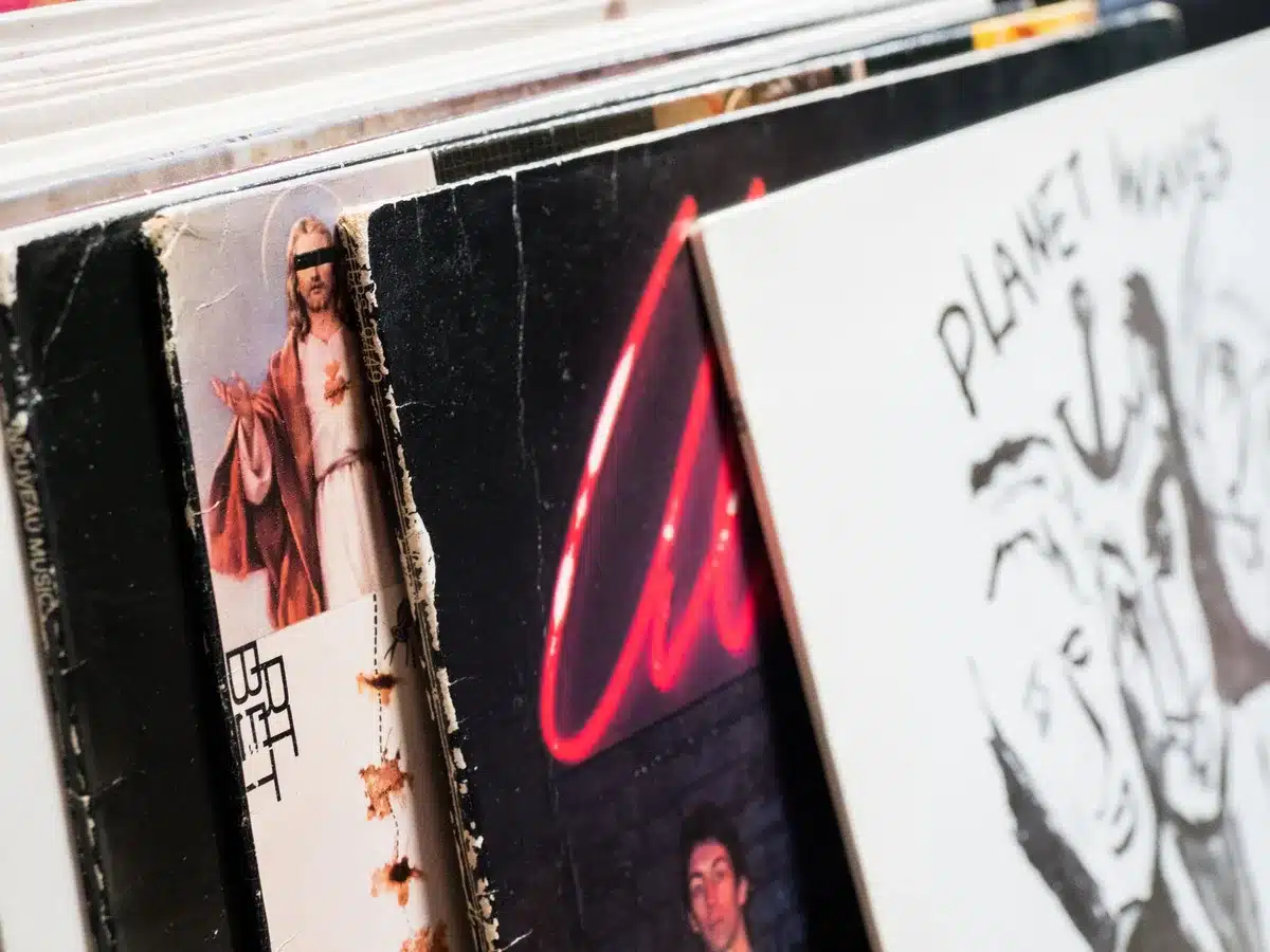 Album artwork or vinyl record displayed, representing a music release