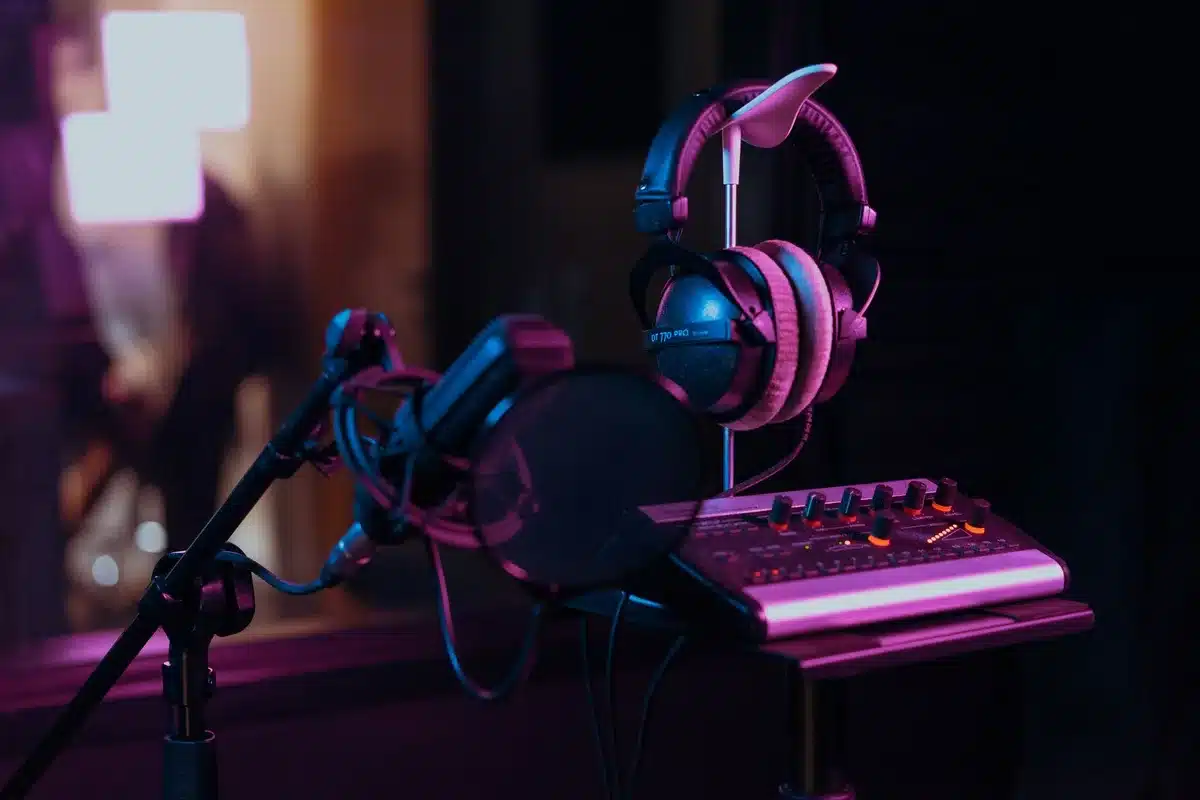 Producer working in a home studio with recording equipment and monitors