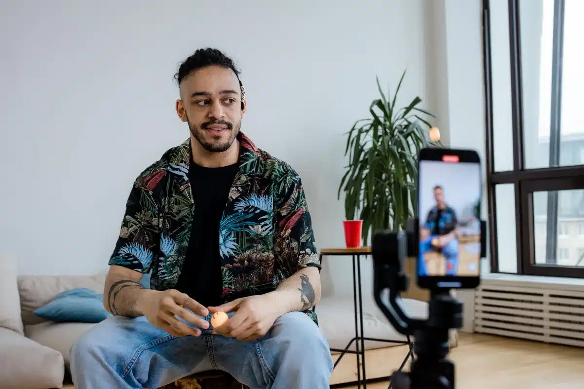 Content creator recording a video message on a smartphone to address an announcement