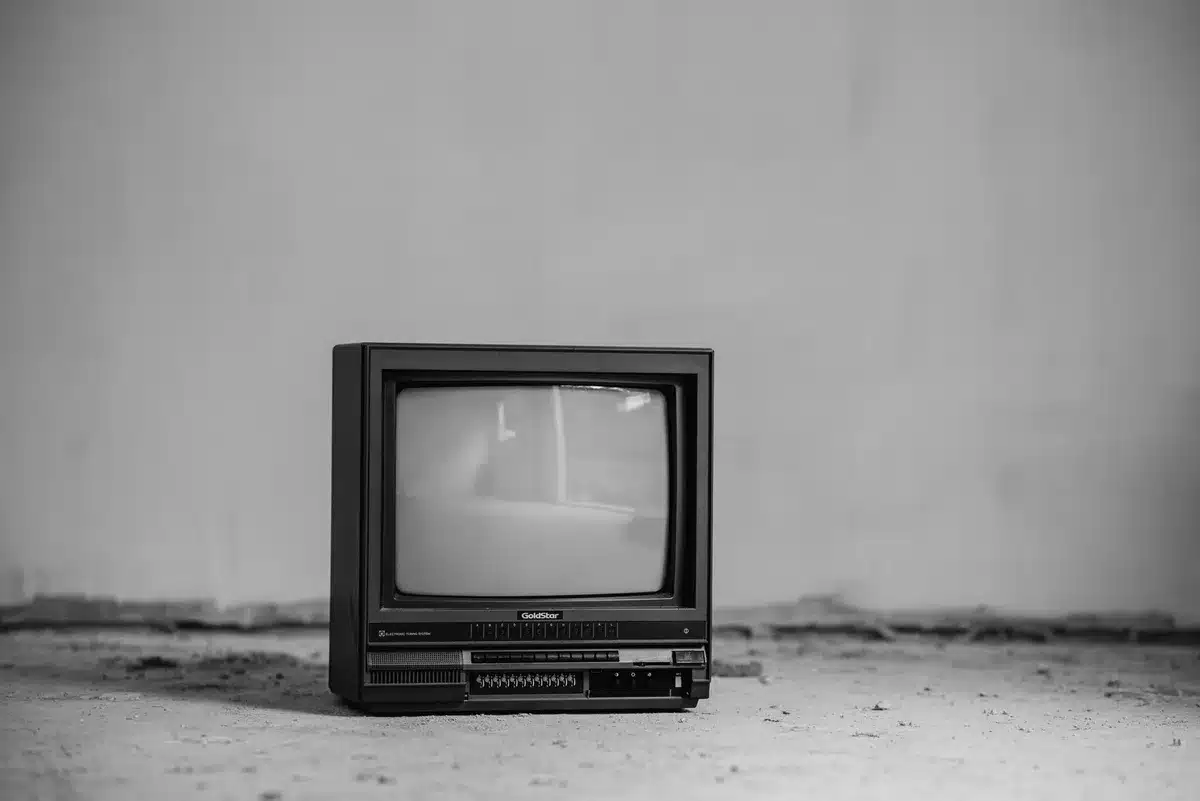Empty television soundstage with production equipment and darkened studio space