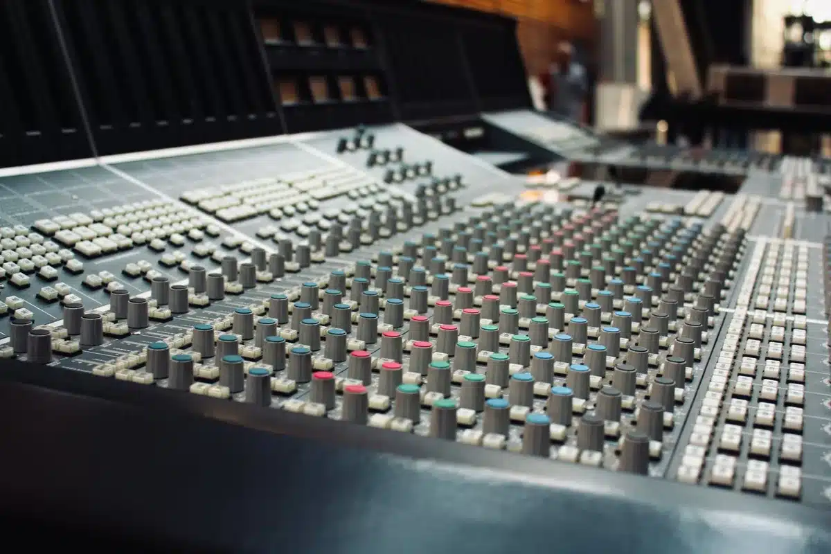 Recording studio mixing console with multiple guitar and instrument tracks