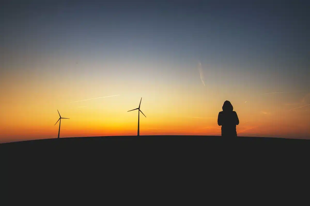 Silhouette of a figure bathed in golden sunlight, absorbing solar energy