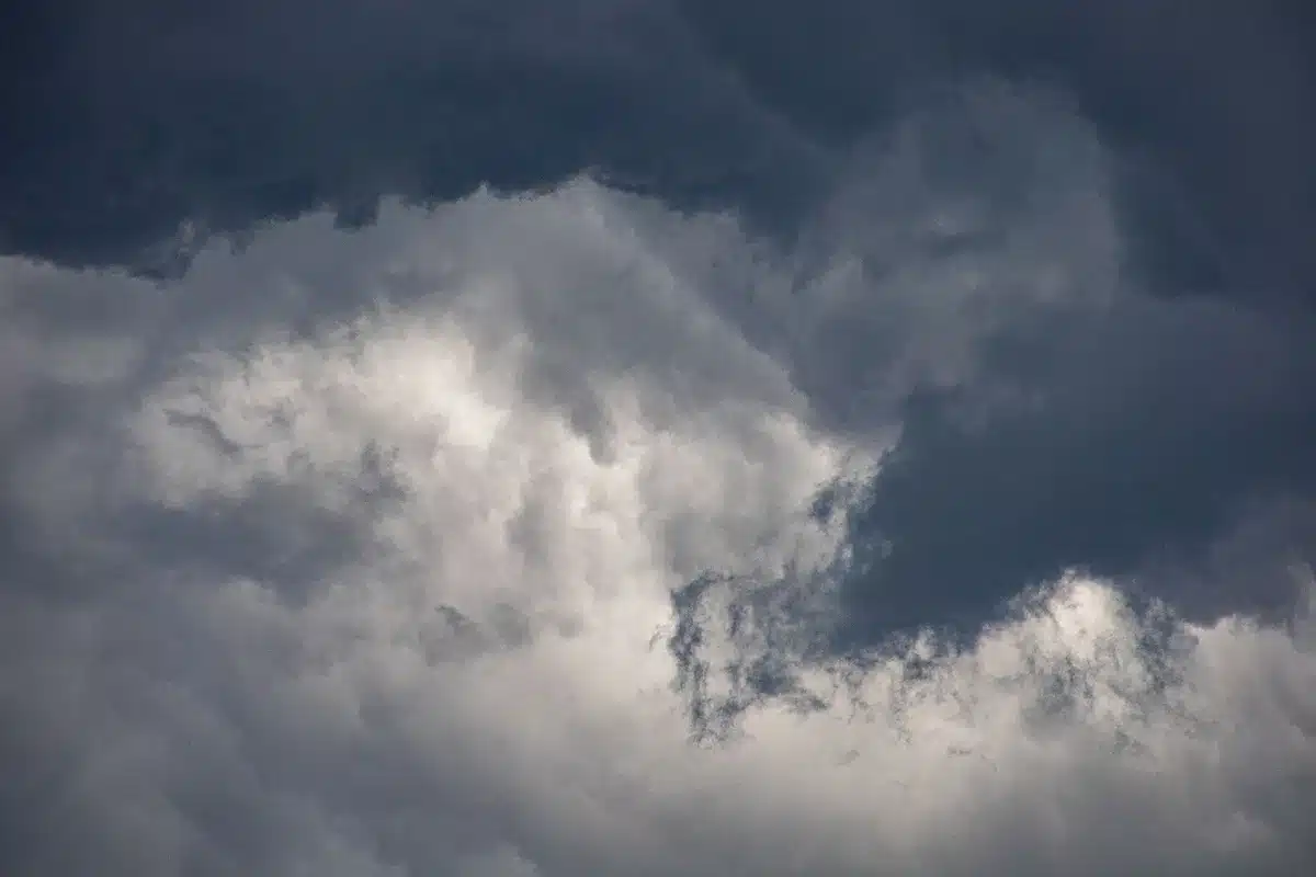 Dark storm clouds gathering ominously on the horizon