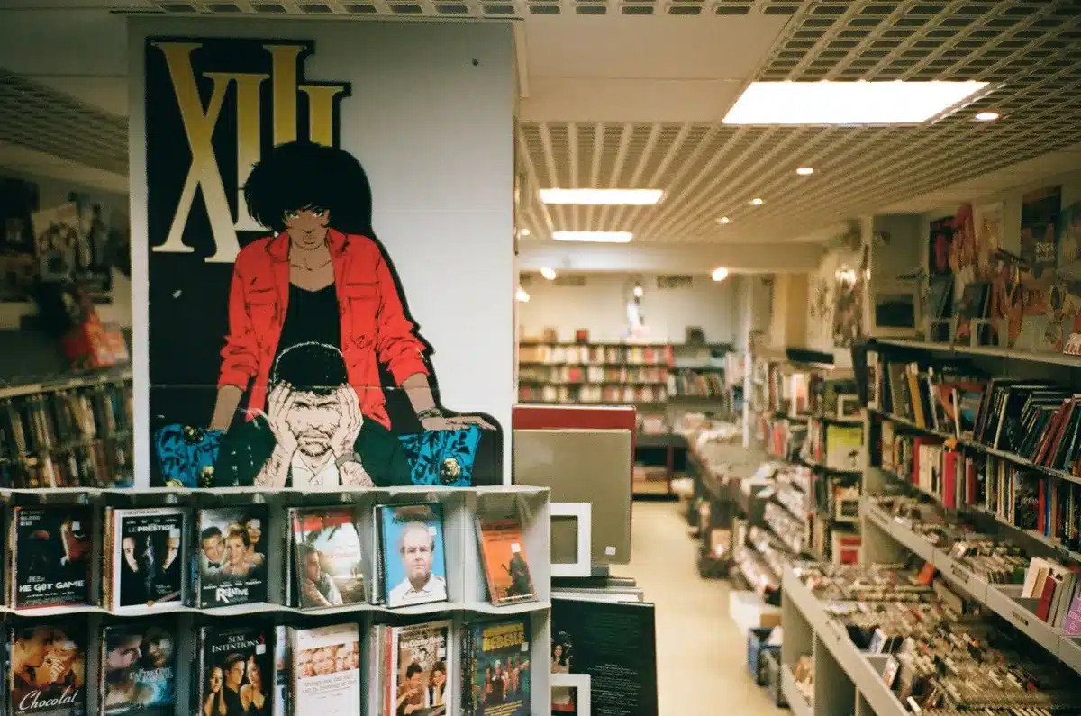 Comic books displayed on retail shelves with multiple covers and variants visible