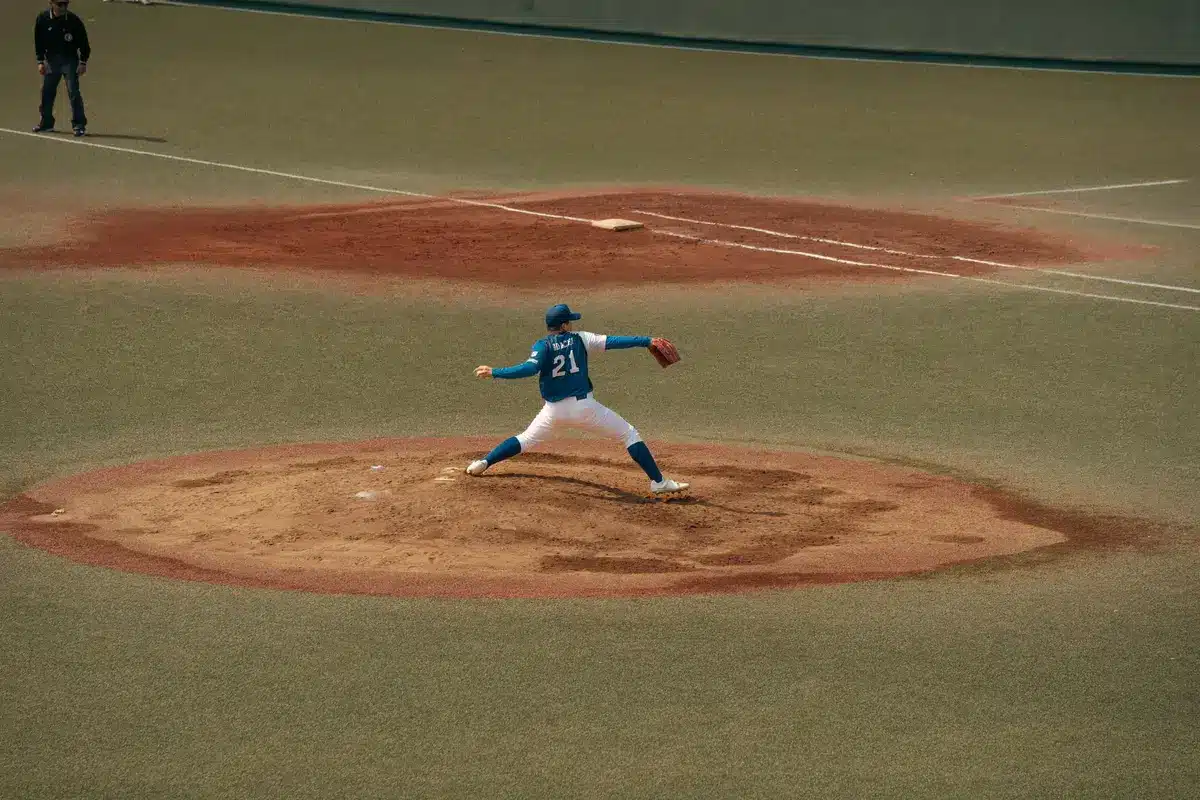 Young baseball player at bat during a major league game in a crowded stadium