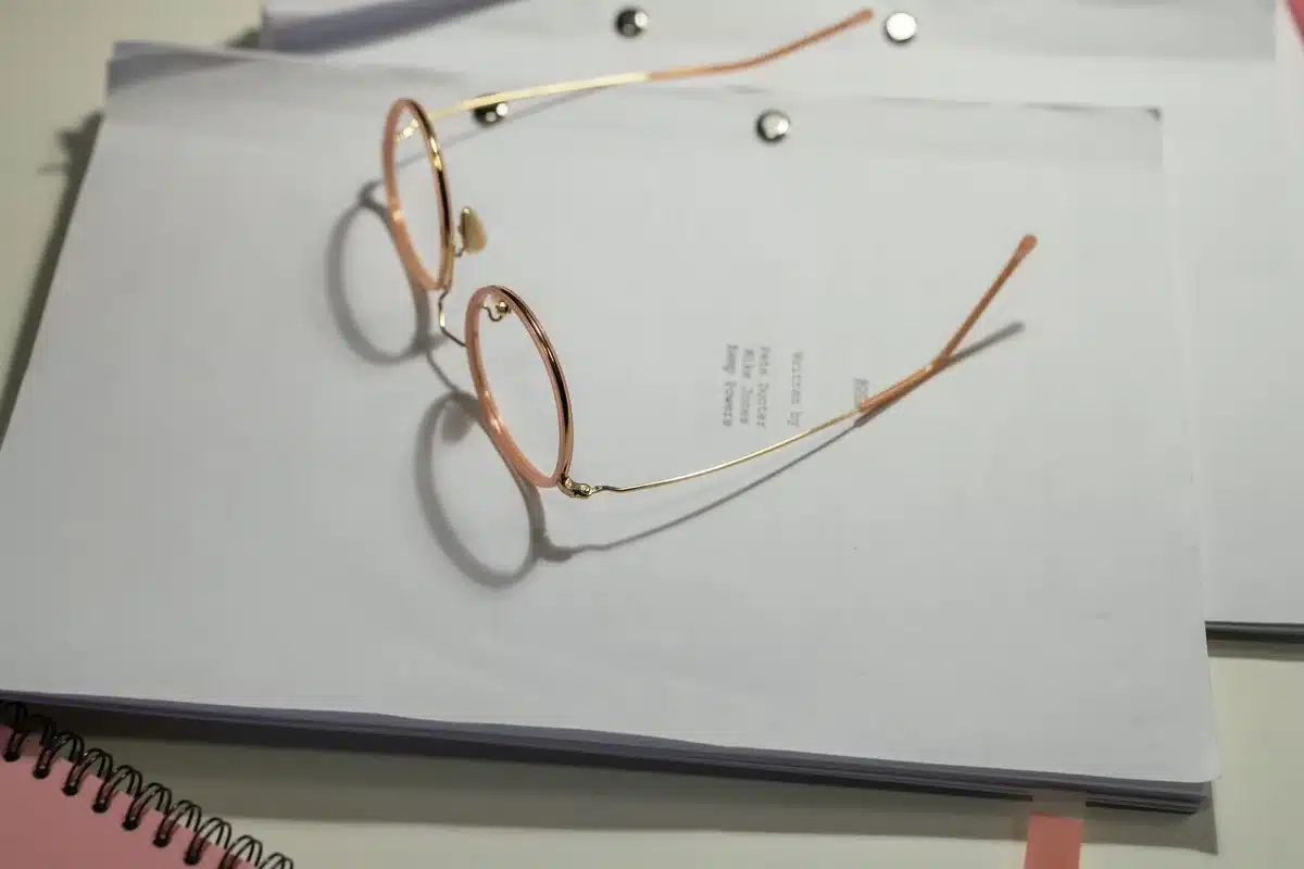 Writing desk with scripts and notes in a television production studio workspace