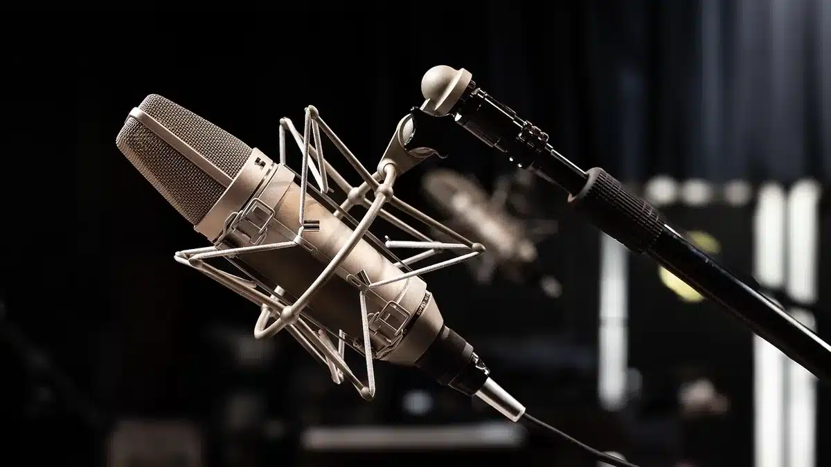 A producer and musicians collaborating in a recording studio during an album session.