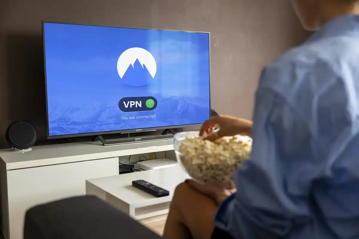 Household watching a movie on a smart TV, illustrating streaming premiere impact