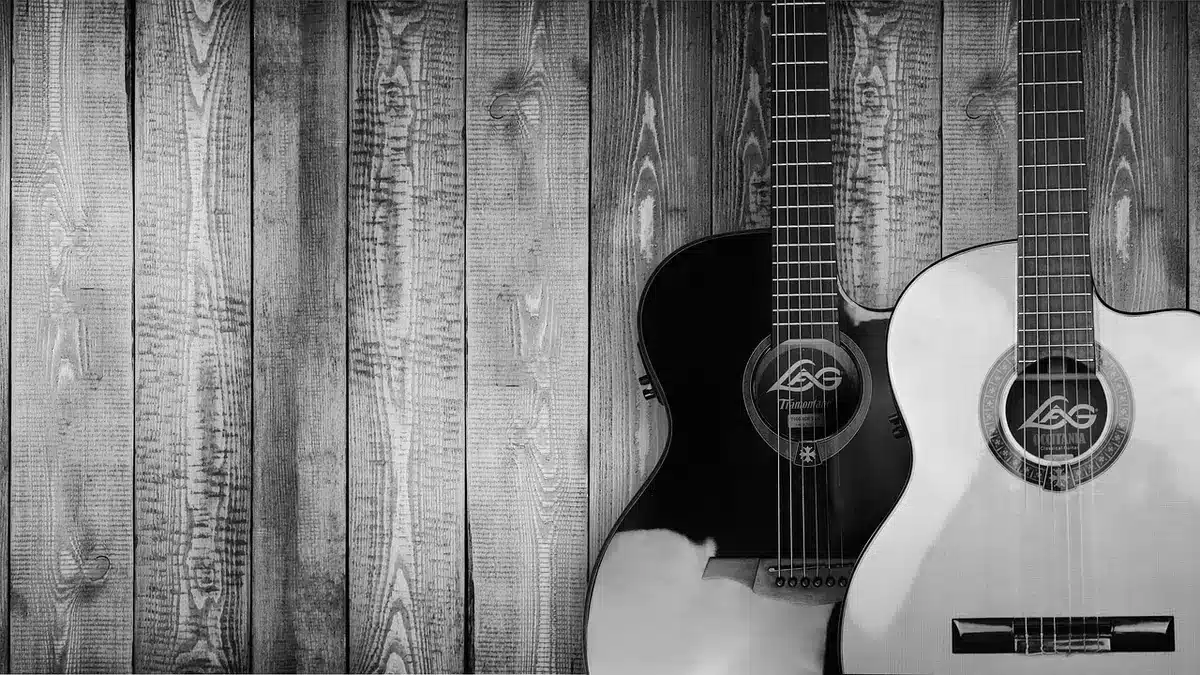 Close-up of guitar strings being retuned to identical pitches