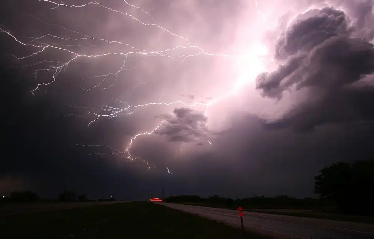 Storm-scarred skies and lightning effects creating high-energy visual contrast in comic panels