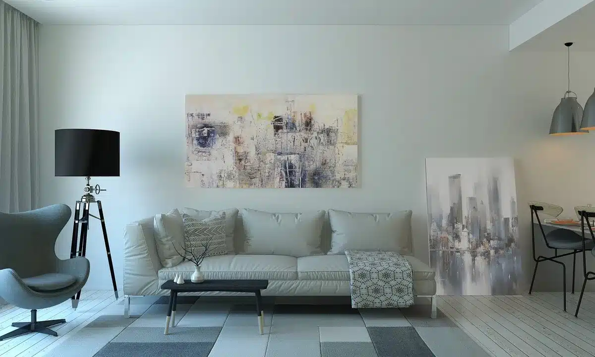 Empty living room with couch, mug and blurred TV streaming interface