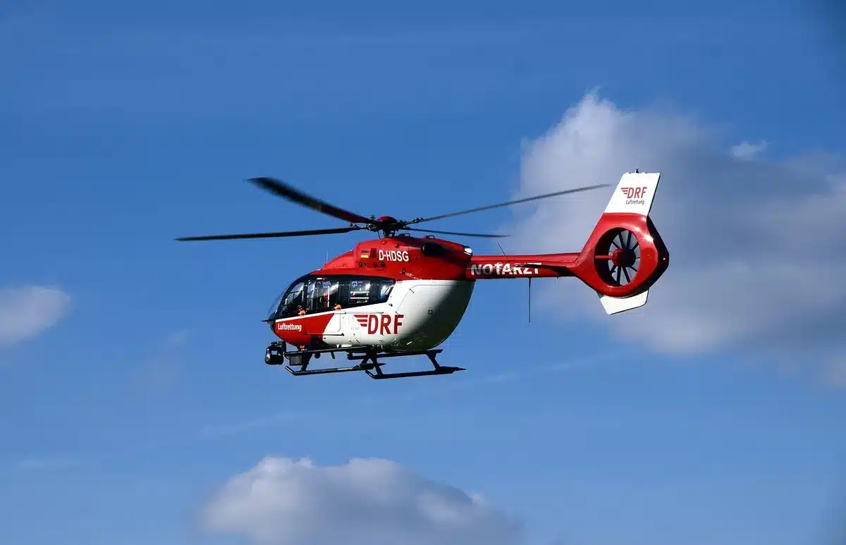 Helicopter wreckage and emergency response after mid-air collision over a city