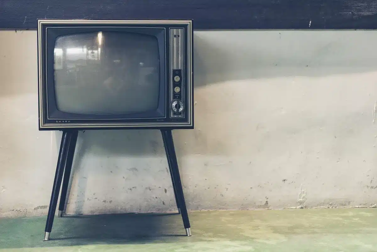 A diverse ensemble cast on a television set