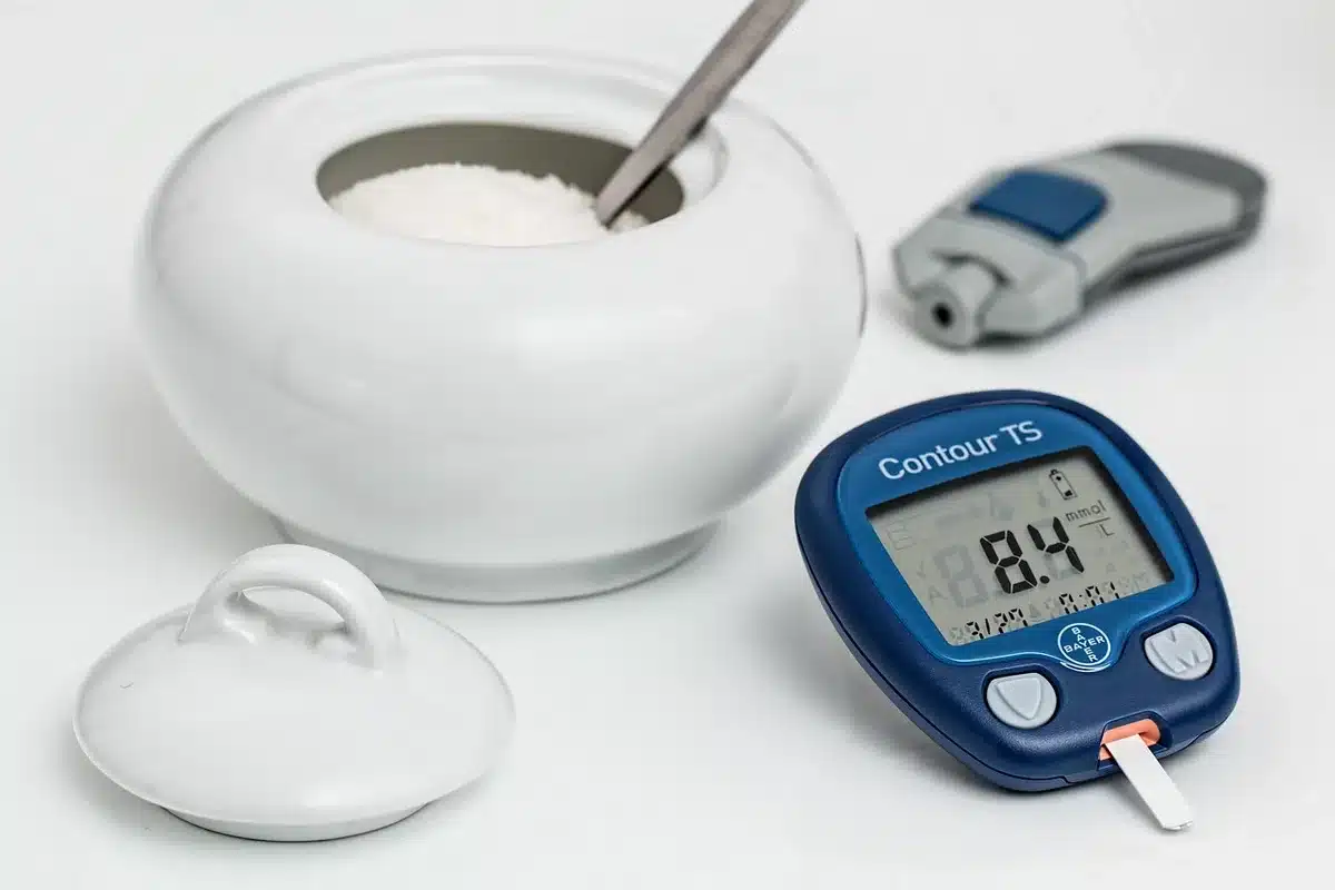 Diabetes management tools and health monitoring equipment on a table.