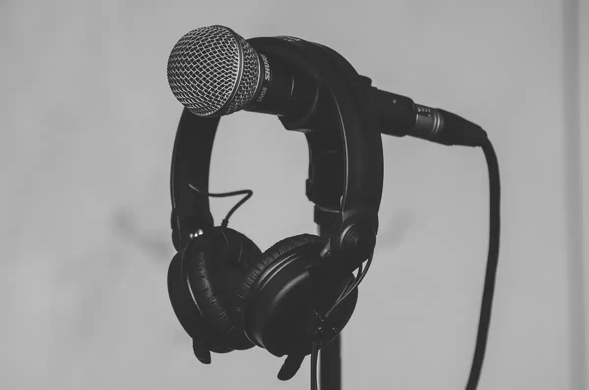 Studio scene with a producer at mixing desk, headphones on