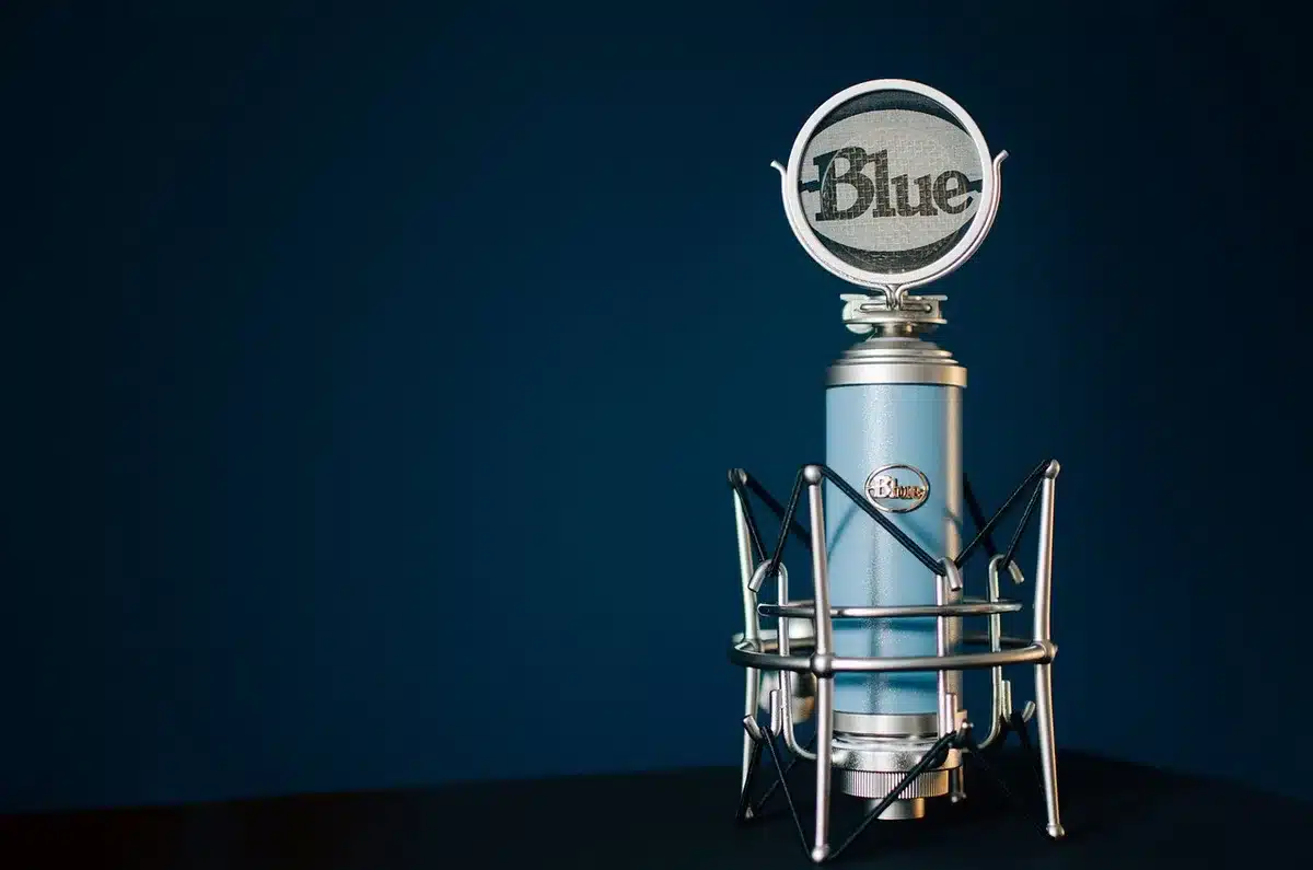 Broadcast sound booth with a microphone and script pages for a game show announcer