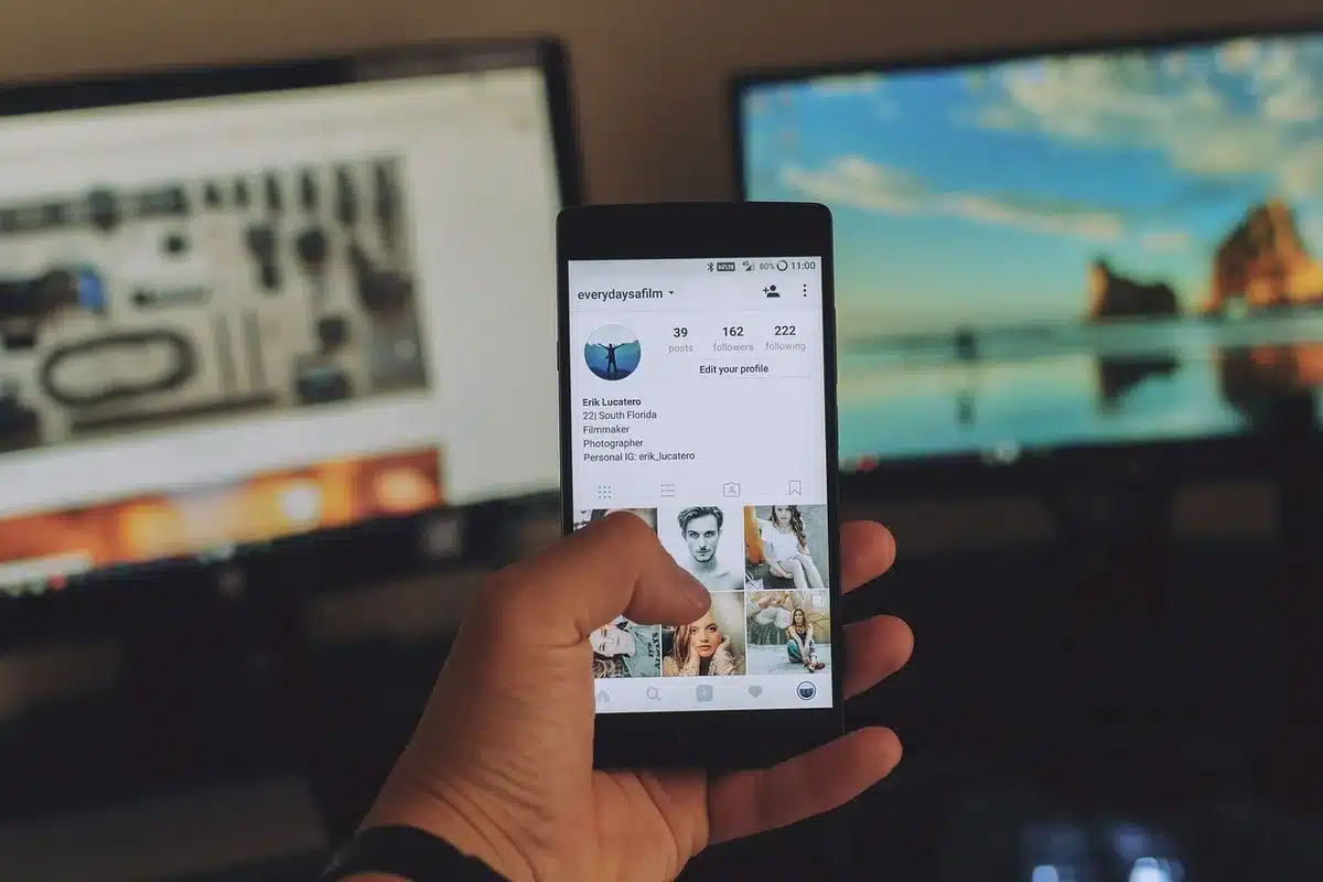 Creator filming short-form video on smartphone with engagement overlays