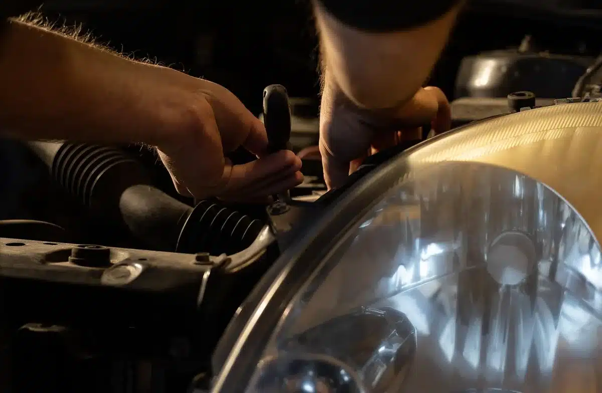 Closeup of mechanic's hands and tools in a workshop