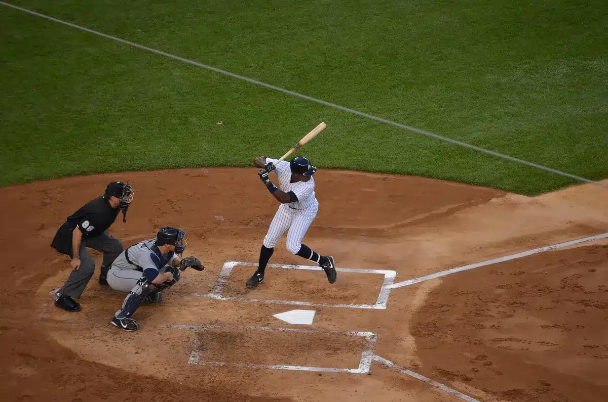 Ceremonial first pitch captured mid-throw, ball in motion toward catcher