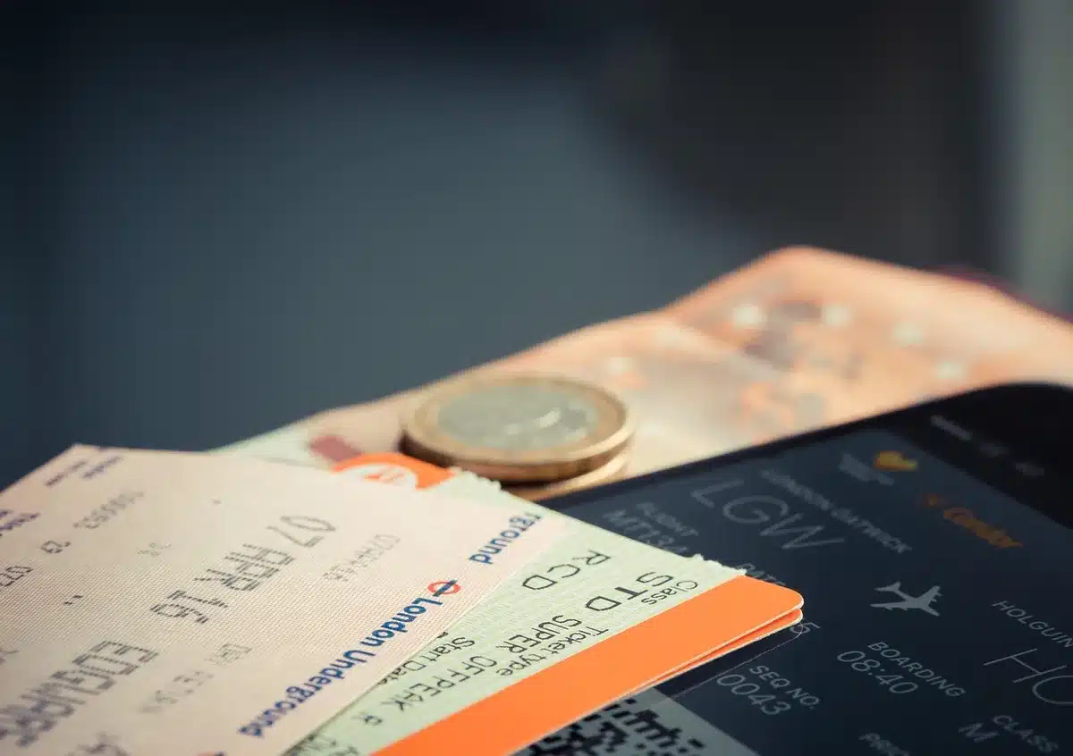 Concert tickets next to travel items and itinerary