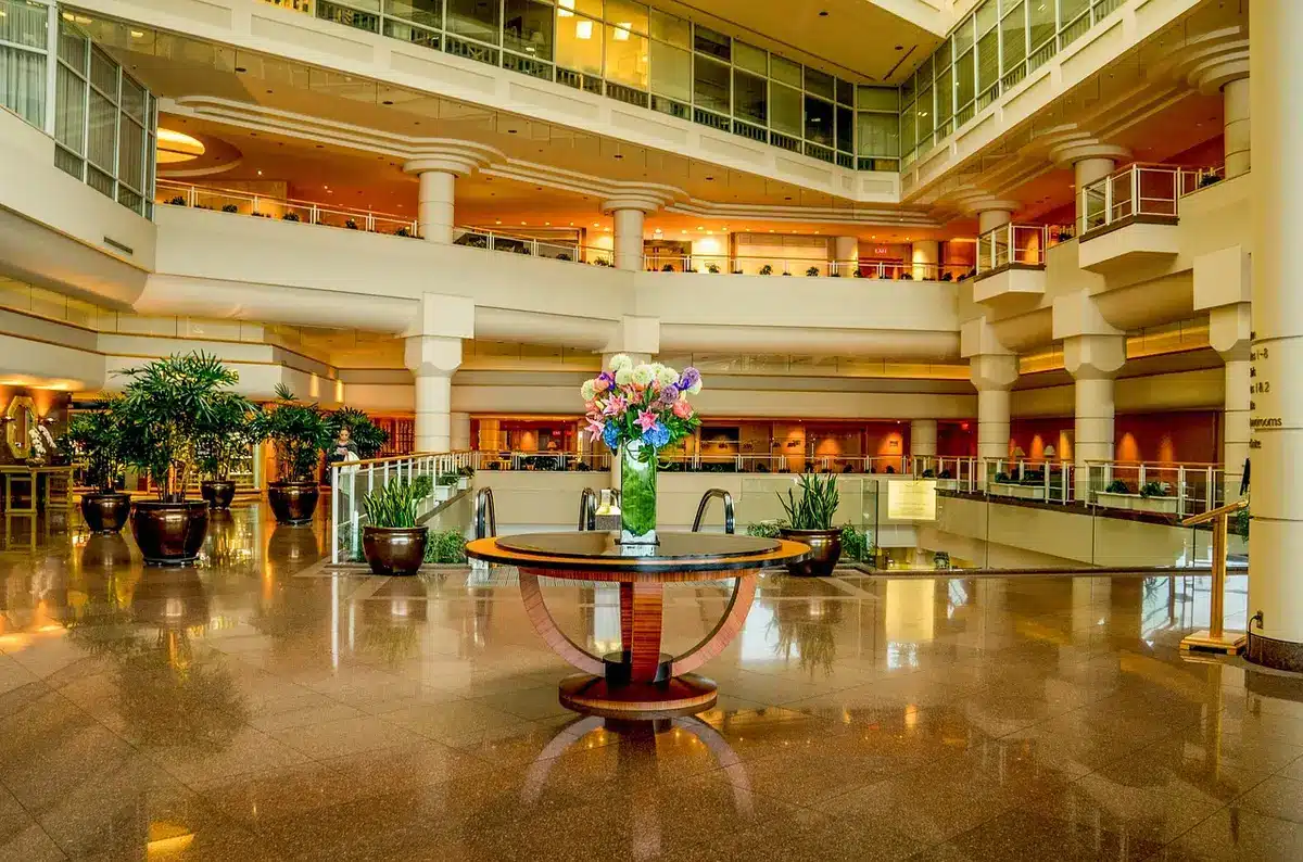 Hotel lobby scene suggesting a disturbance with security staff nearby