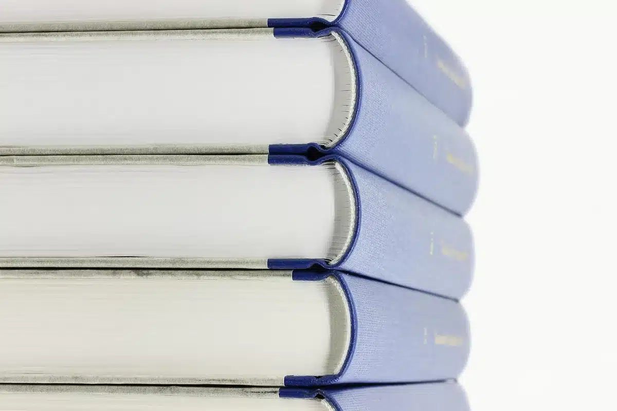 Stack of feminist books and a notebook referencing Steinem's writings