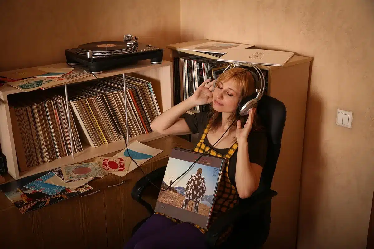 Close-up of an album sleeve and record on a wooden table