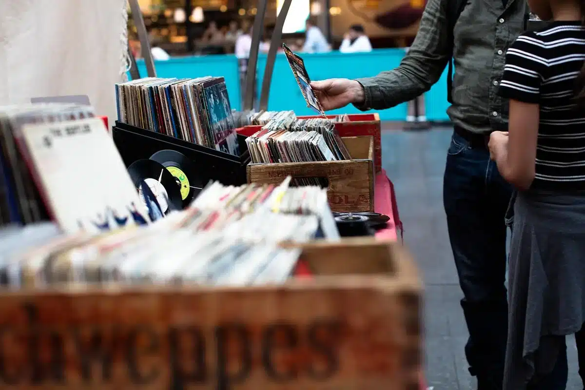 Collector browsing variant covers in a comic shop