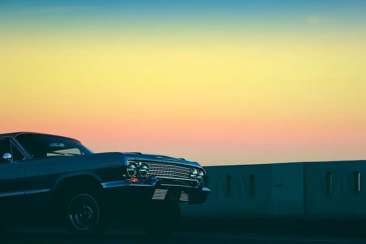 Orange lowrider featured in a minimal music-video set