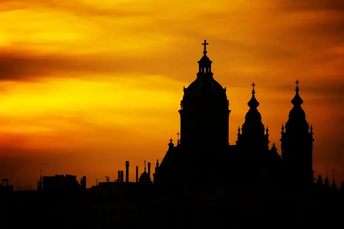 Silhouetted march and distant dark tower on a windswept plain at dusk