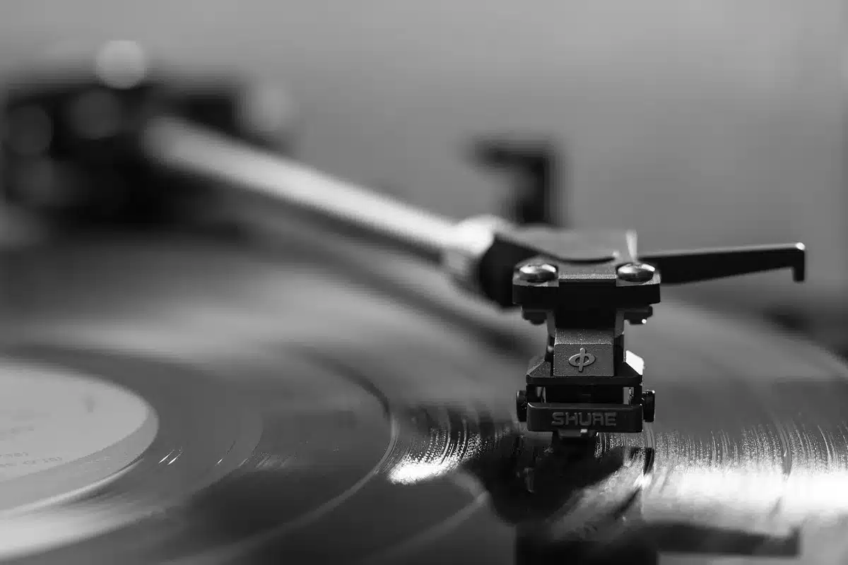 Stack of vinyl records and music reviews on a table